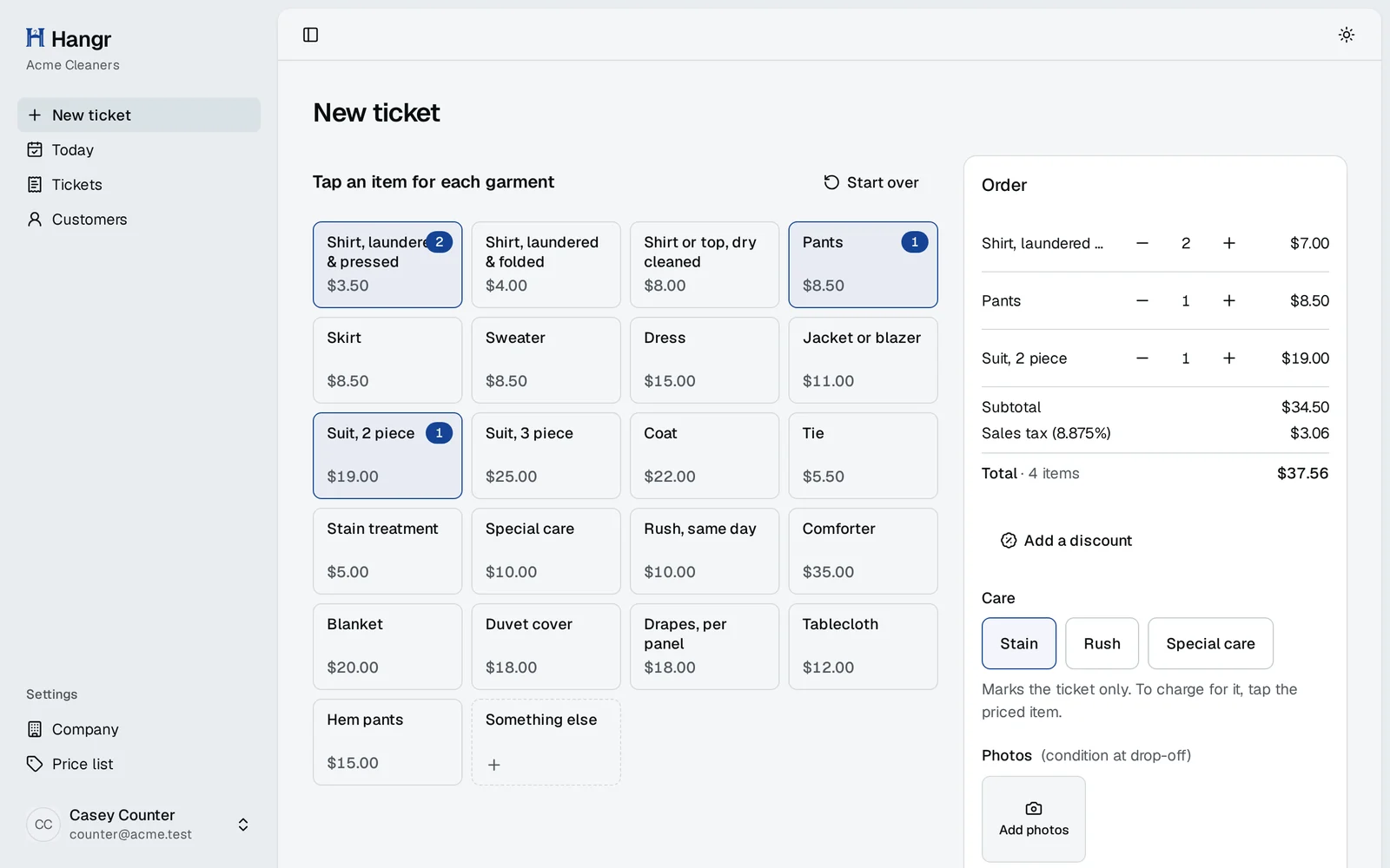 Taking an order: price tiles for each garment on the left, the order on the right, with subtotal, sales tax, total and care flags.